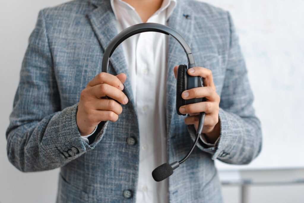 interpreter holding a headset